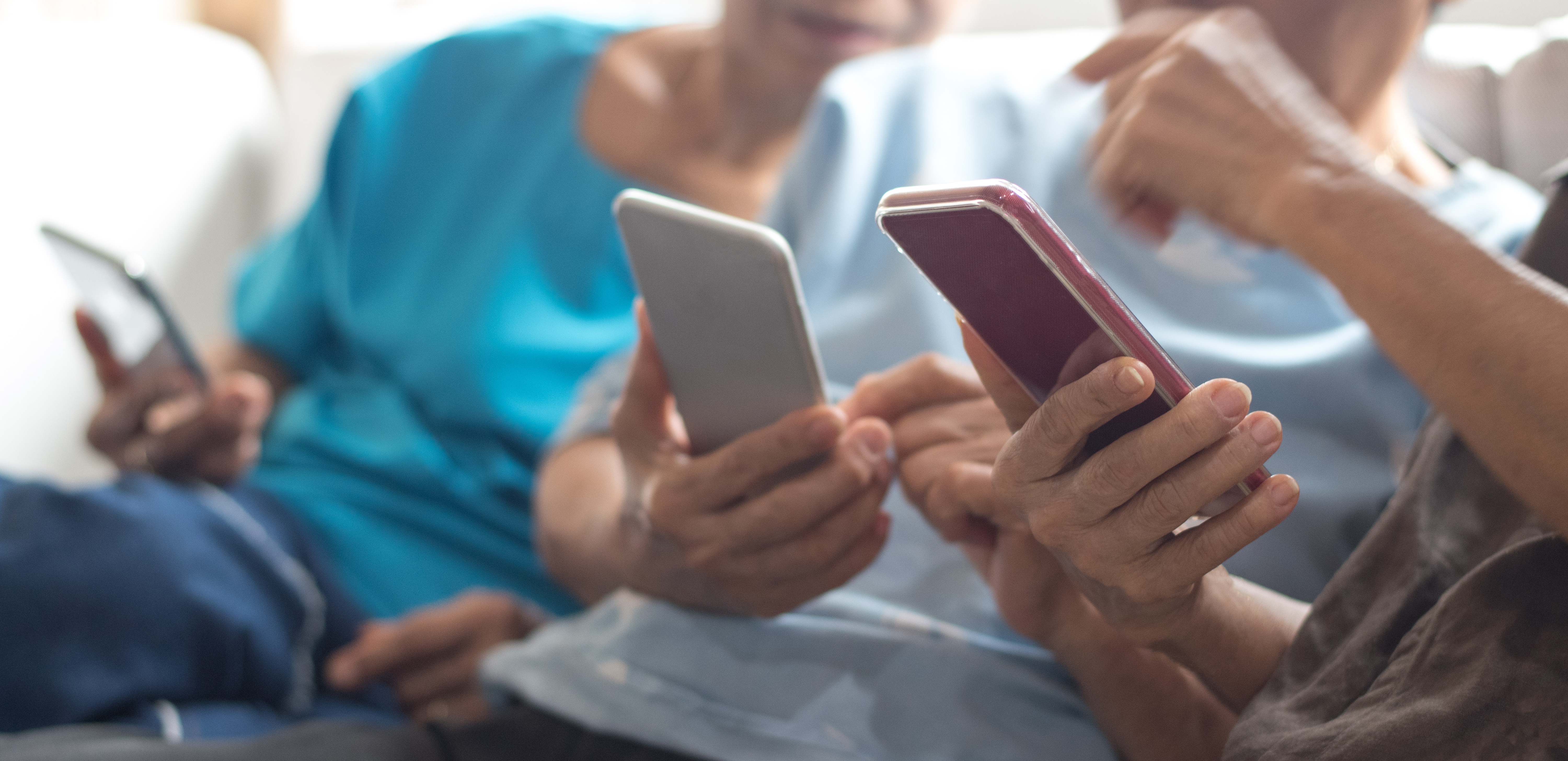 Group of people using smartphones